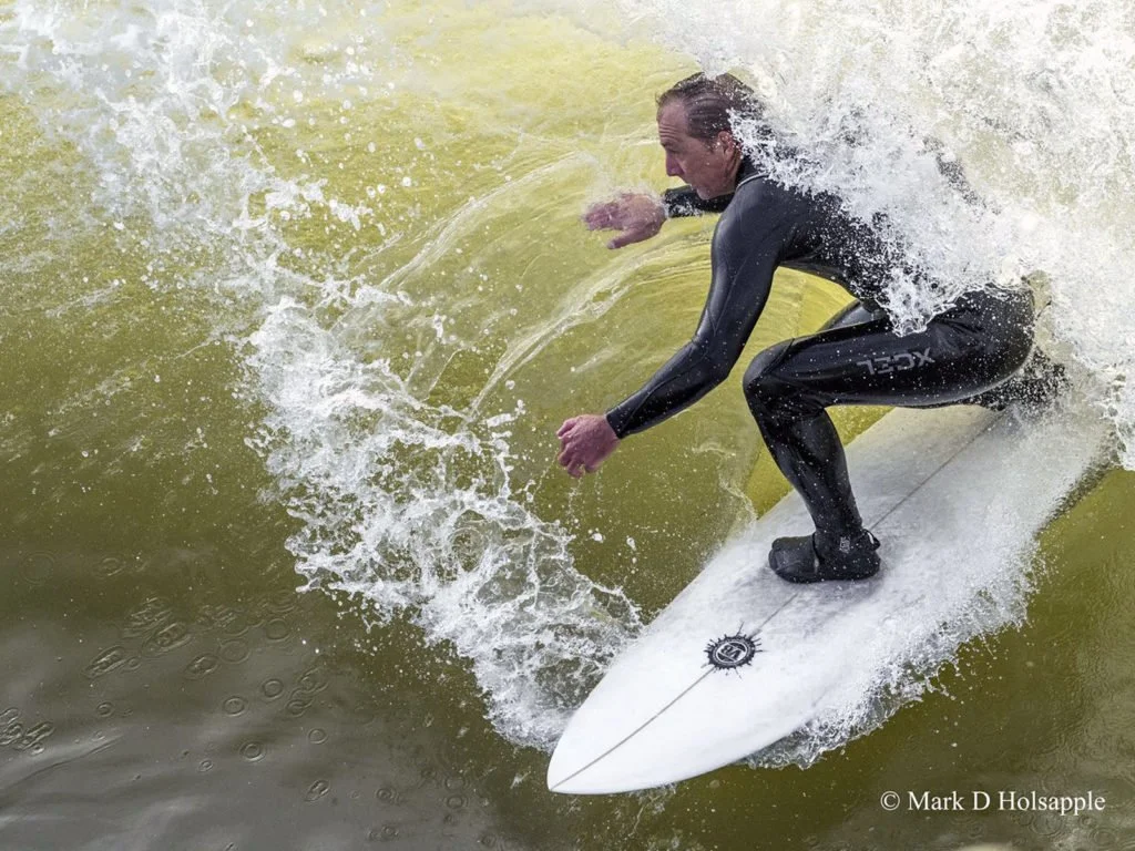 Surfer Jake Wormhoudt riding a Vince Broglio surfboard on a wave, photo by Mark D Holsapple