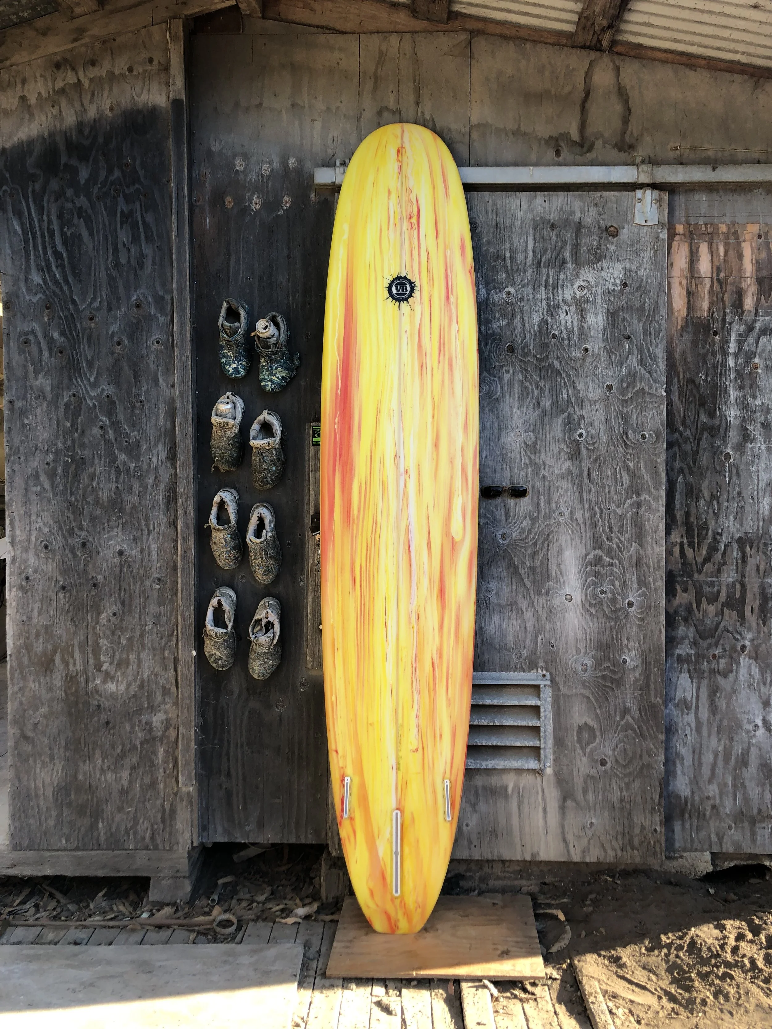 The Log yellow surfboard by Vince Broglio